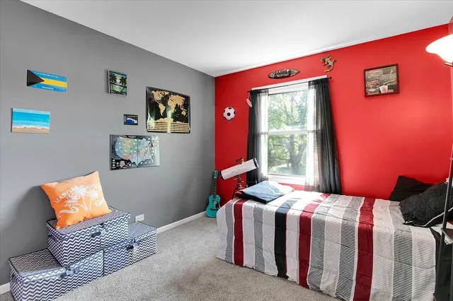 a bathroom with a granite countertop toilet sink and mirror