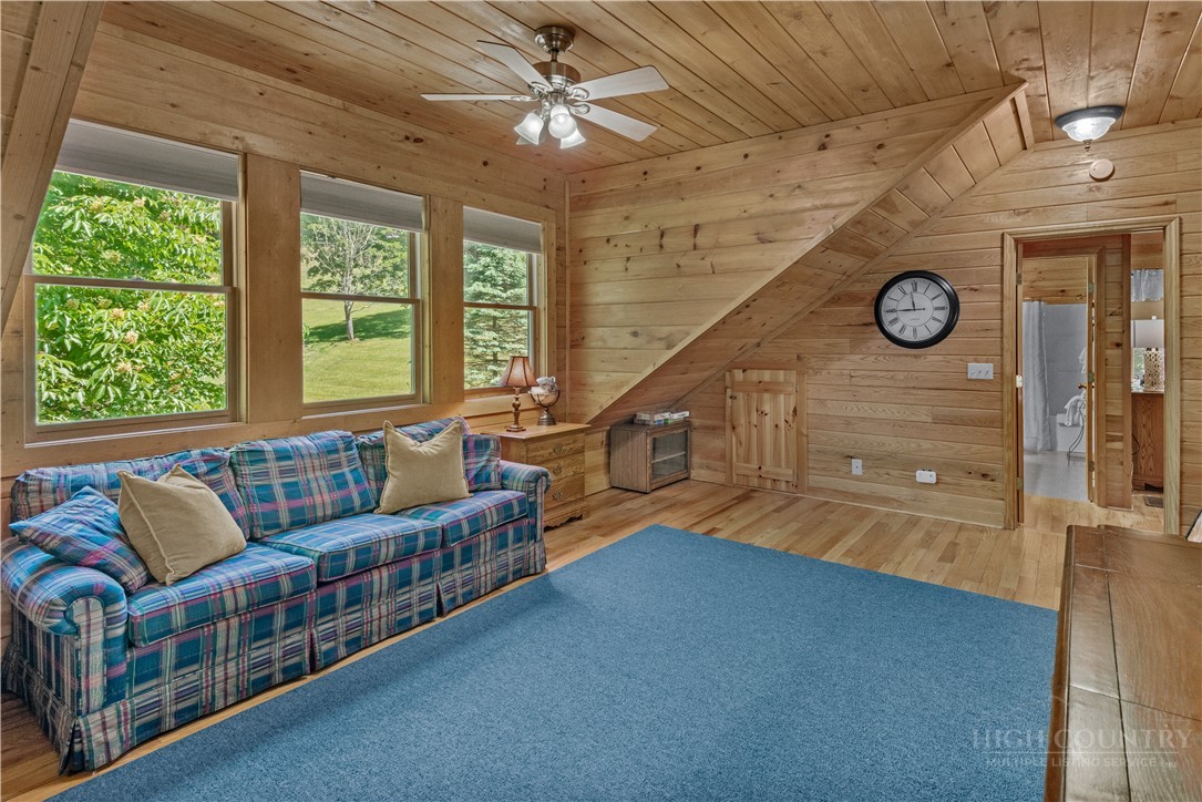 339 Welcome Way Boone, NC 28607 - Photo 15 of 20 a living room with furniture and a large window