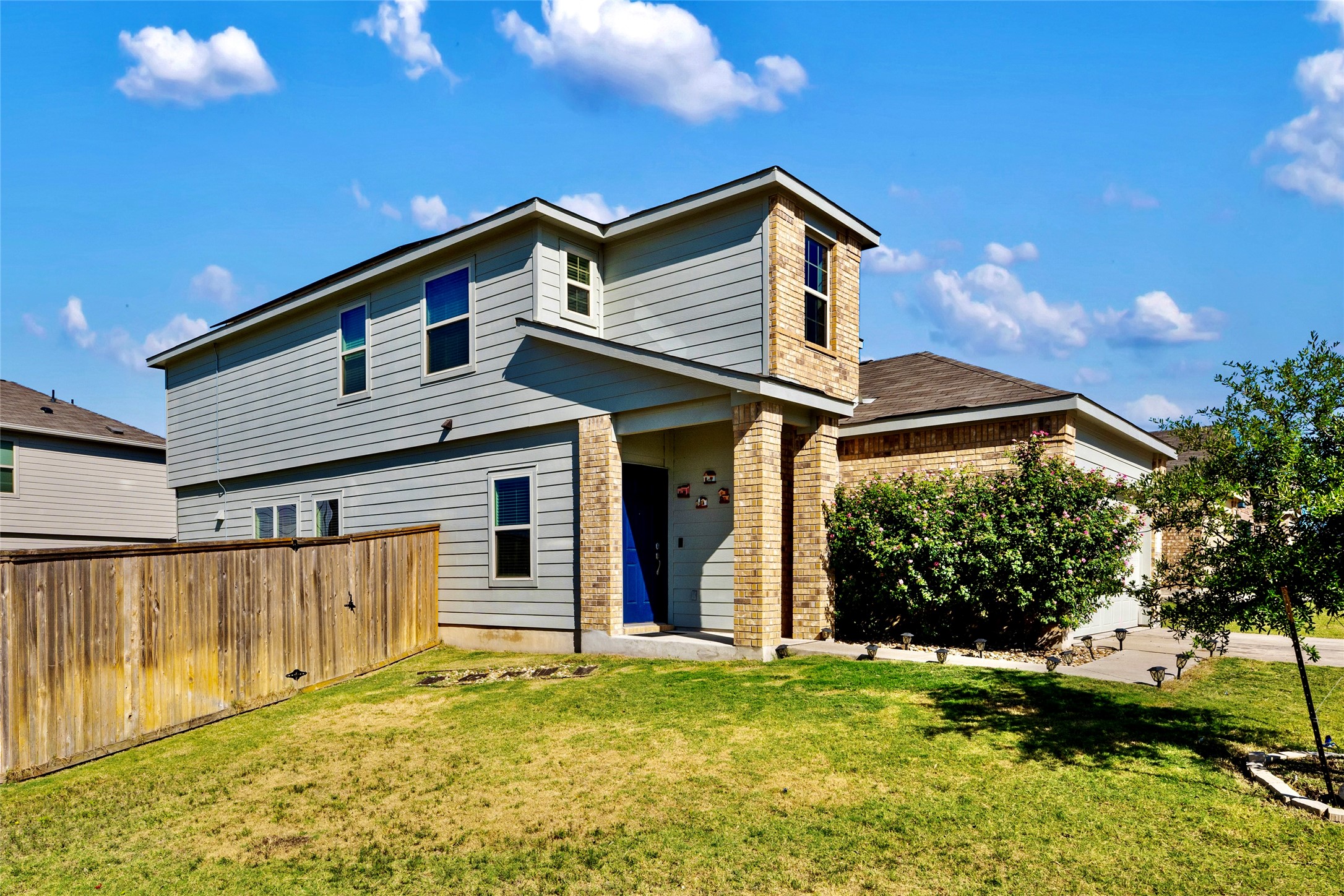 524 Circle Way, Unit 12F Jarrell, TX 76537 - Photo 3 of 34 Back of property with brick siding