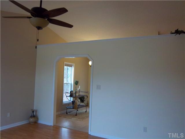 1003 Delham Road Knightdale, NC 27545 - Photo 3 of 18 Notice the openness from the cathedral ceiling & plant shelf-new light fixture