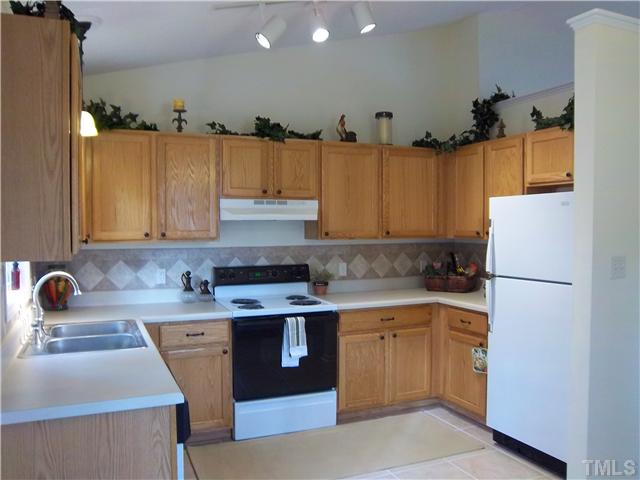 1003 Delham Road Knightdale, NC 27545 - Photo 4 of 18 Enjoy preparing a meal in this beautiful kitchen complete with new tile flooring, light fixtures, & tile backsplash