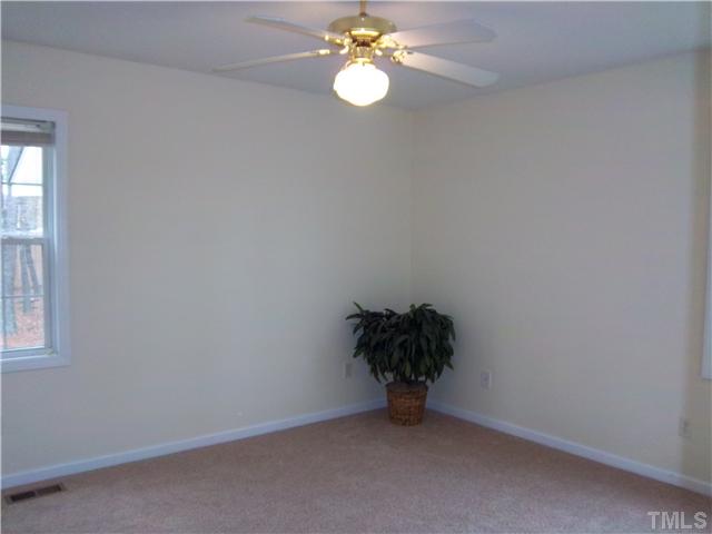 1003 Delham Road Knightdale, NC 27545 - Photo 7 of 18 Lots of light in the master bedroom with new carpet and fan/light fixture