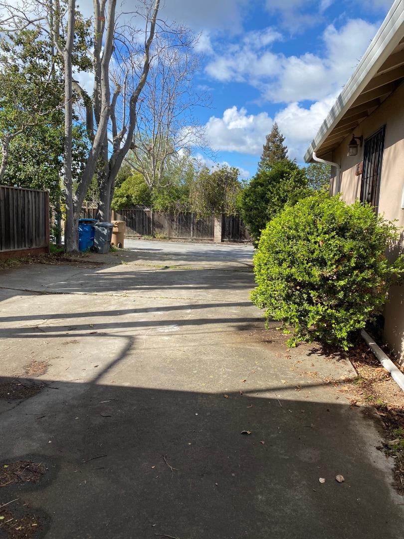 10237 University Way Cupertino, CA 95014 - Photo 12 of 12 a view of a house with a yard and potted plants