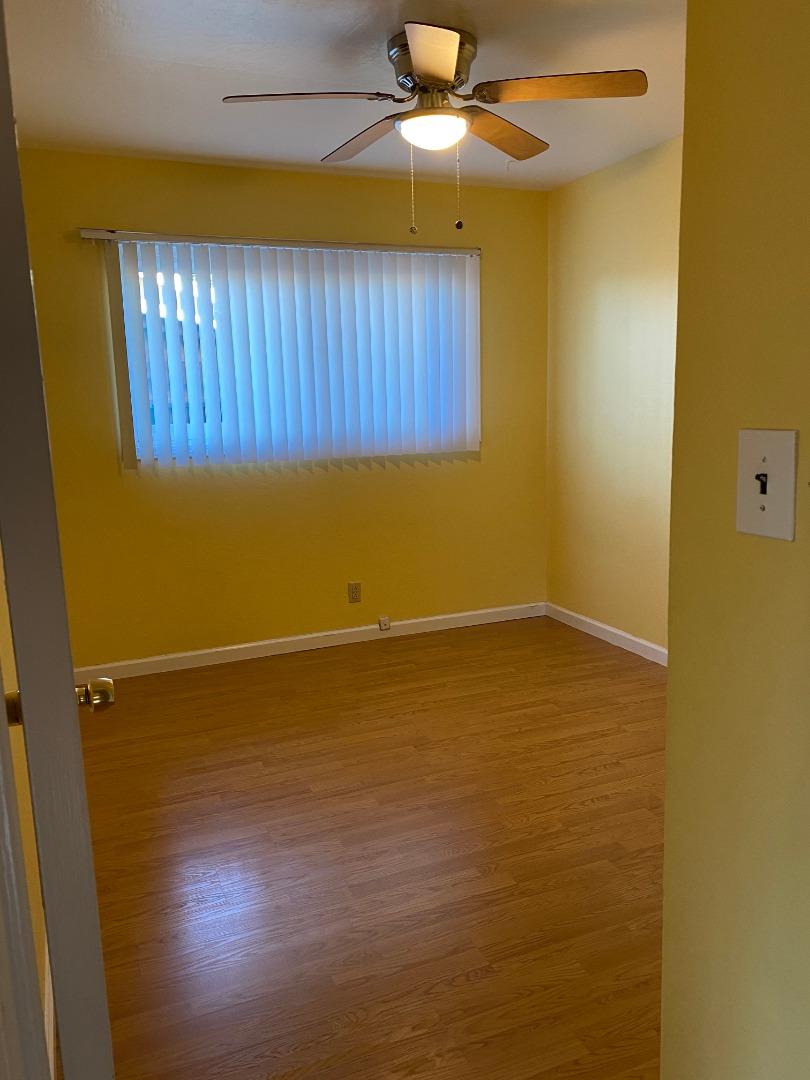10237 University Way Cupertino, CA 95014 - Photo 7 of 12 en empty room with wooden floor and fan