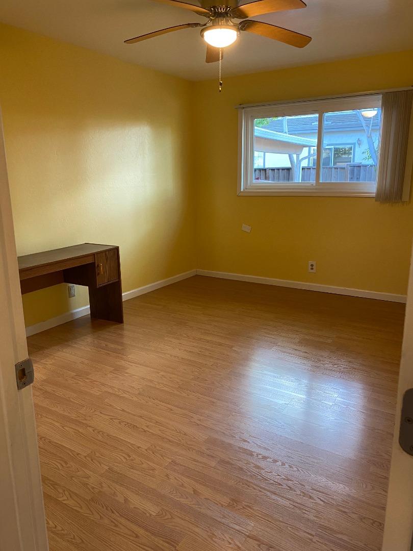 10237 University Way Cupertino, CA 95014 - Photo 8 of 12 a view of an empty room with wooden floor