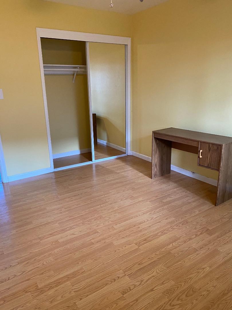 10237 University Way Cupertino, CA 95014 - Photo 9 of 12 a view of an empty room with wooden floor and a window