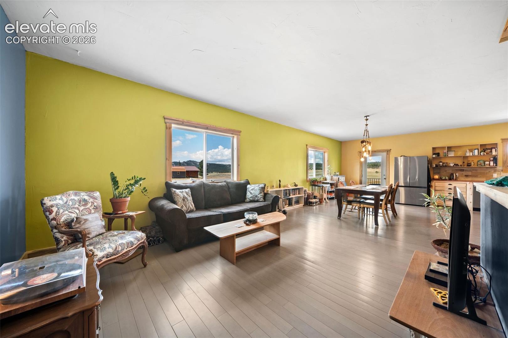 351 High Pasture Road Florissant, CO 80816 - Photo 6 of 42 Open-concept living space filled with natural light.