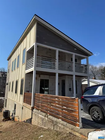 a front view of a house with parking space
