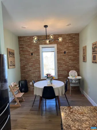 a living room with furniture a rug and a chandelier