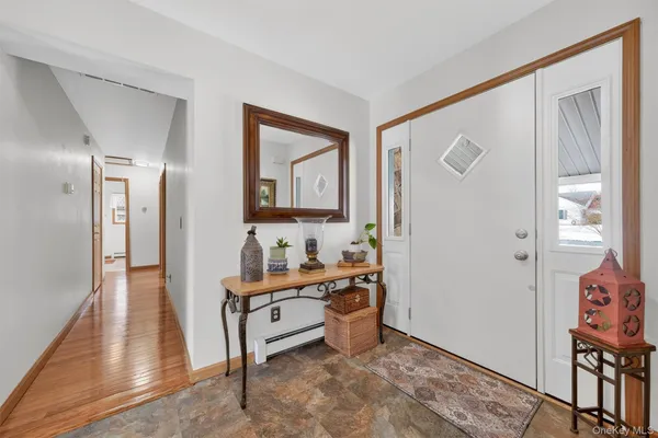 a very nice looking room with a mirror and a wooden floor