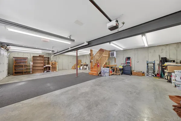 a view of a roof deck with furniture