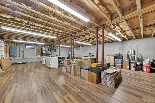 a view of a kitchen with stainless steel appliances granite countertop lots of wooden furniture