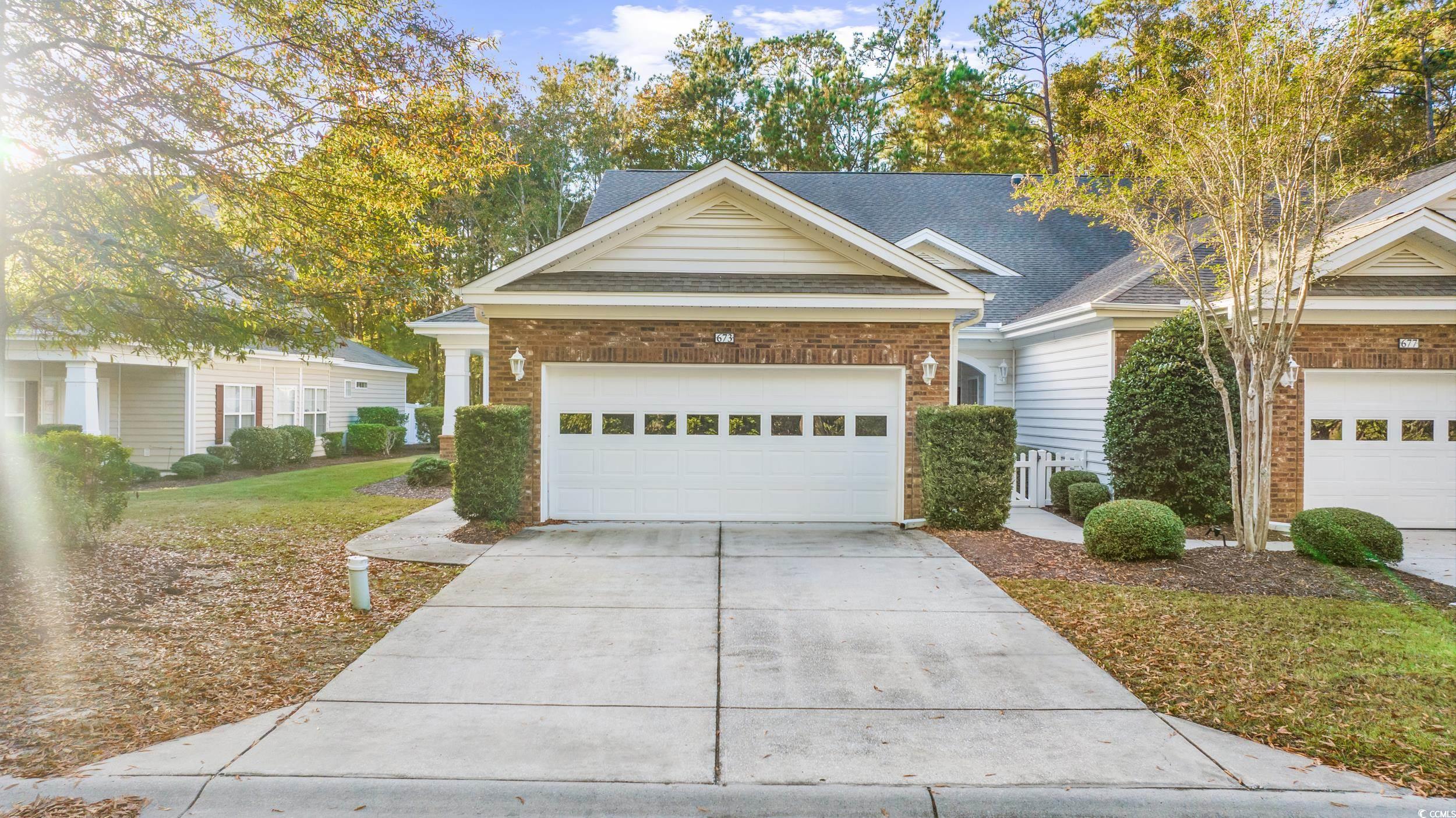 673 Botany Loop, Unit 673 Murrells Inlet, SC 29576 - Photo 1 of 39 Craftsman-style house with a garage