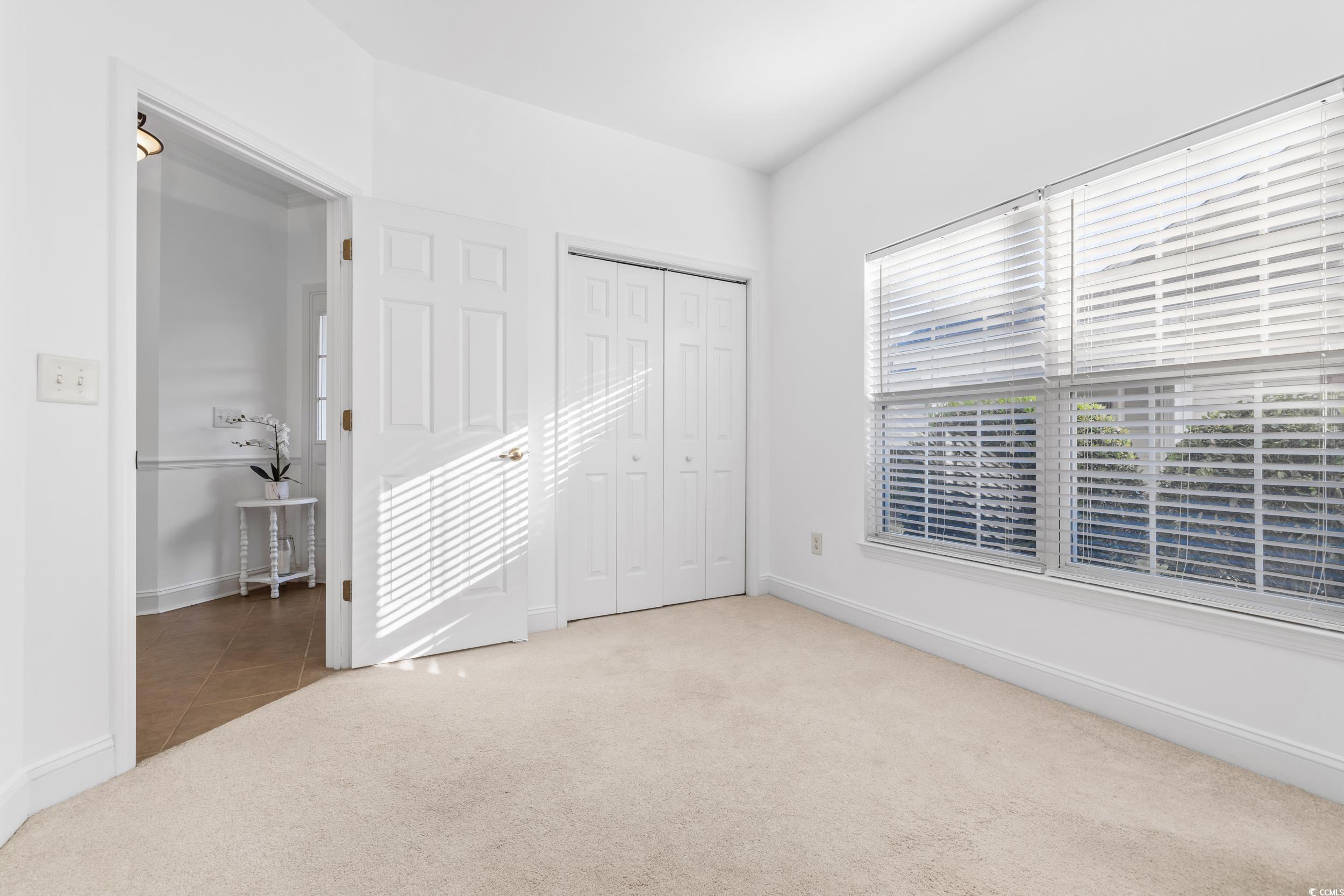 673 Botany Loop, Unit 673 Murrells Inlet, SC 29576 - Photo 11 of 39 Empty room with carpet flooring