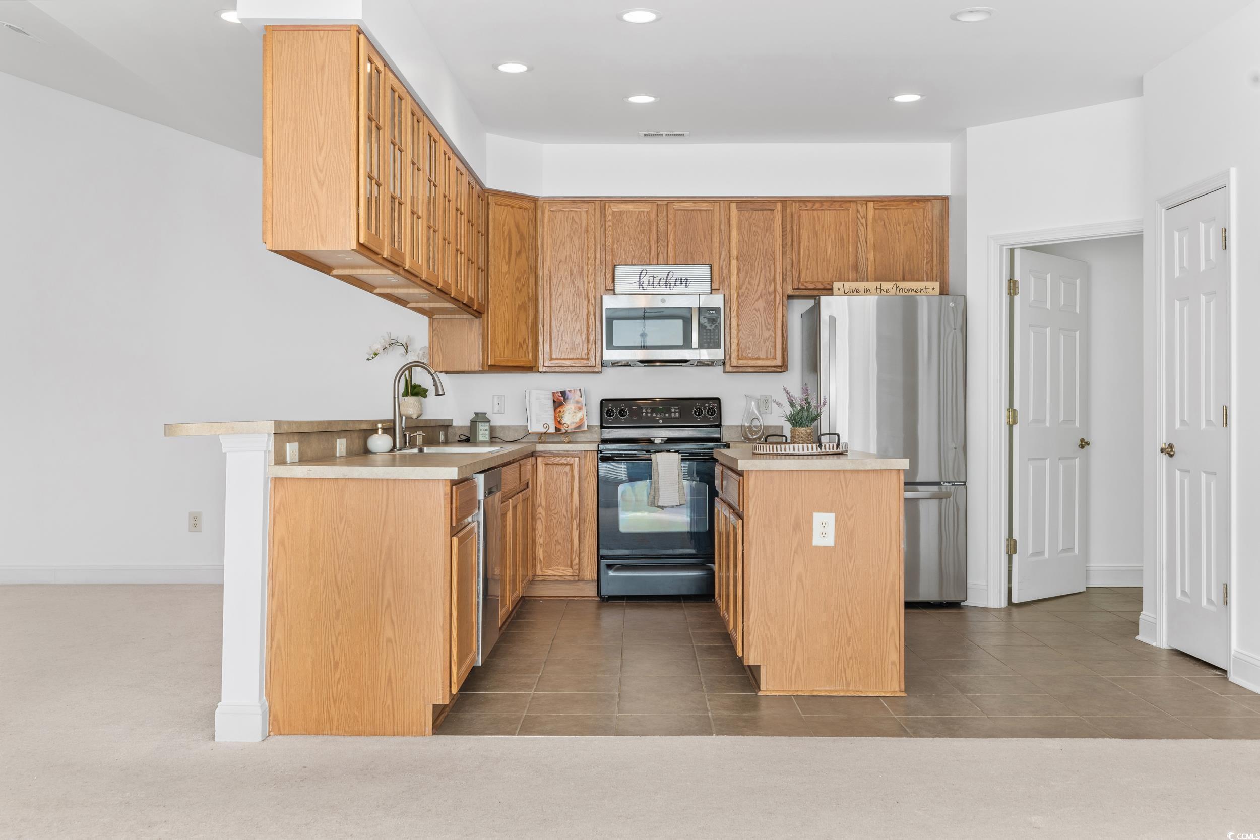 673 Botany Loop, Unit 673 Murrells Inlet, SC 29576 - Photo 16 of 39 Kitchen with stainless steel appliances, sink, dar