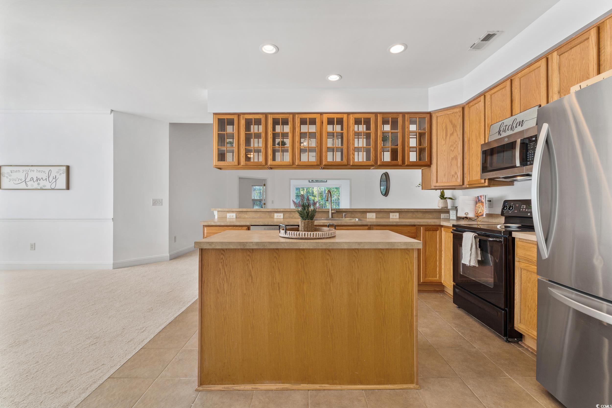 673 Botany Loop, Unit 673 Murrells Inlet, SC 29576 - Photo 20 of 39 Kitchen featuring light carpet, stainless steel ap