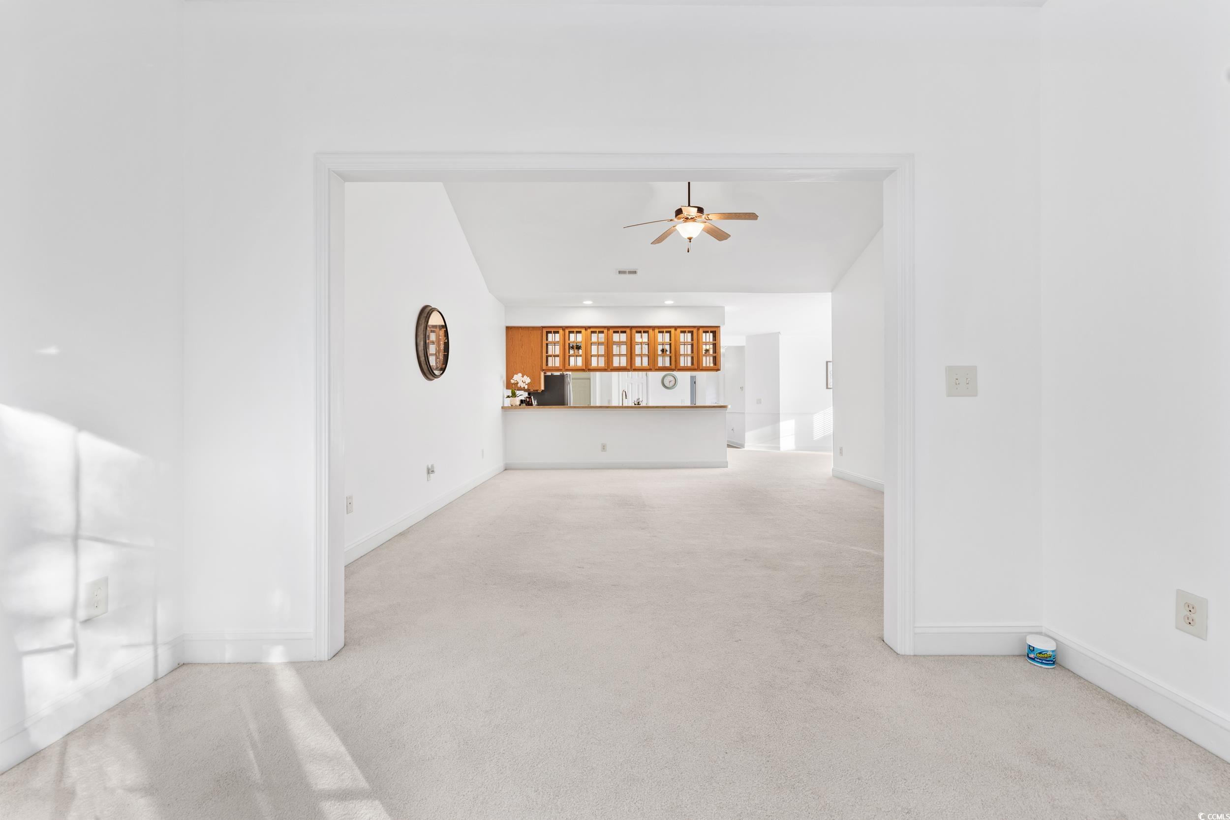 673 Botany Loop, Unit 673 Murrells Inlet, SC 29576 - Photo 23 of 39 Unfurnished living room with carpet flooring and c