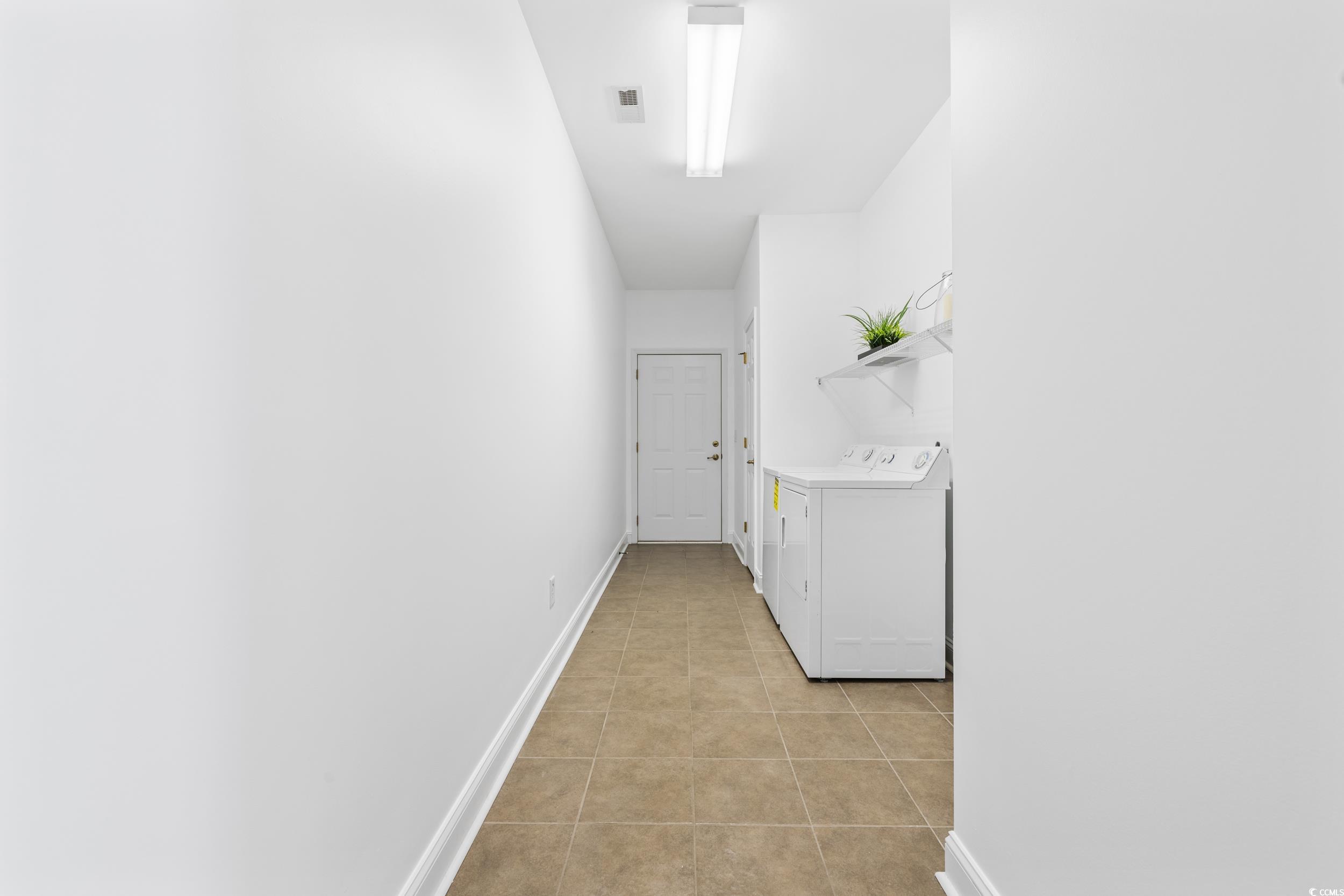 673 Botany Loop, Unit 673 Murrells Inlet, SC 29576 - Photo 24 of 39 Hall featuring light tile patterned flooring and w
