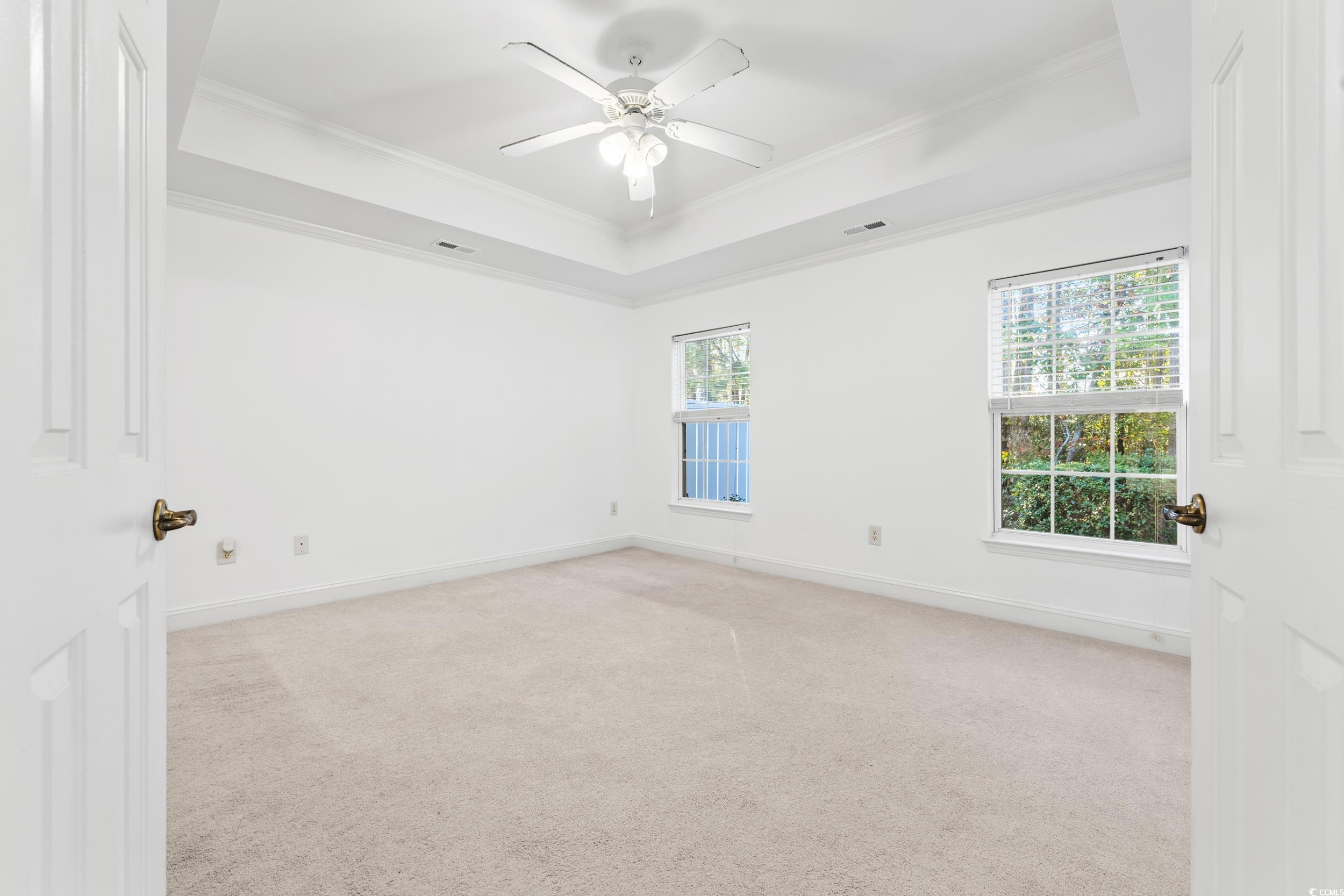 673 Botany Loop, Unit 673 Murrells Inlet, SC 29576 - Photo 27 of 39 Spare room featuring crown molding, a healthy amou