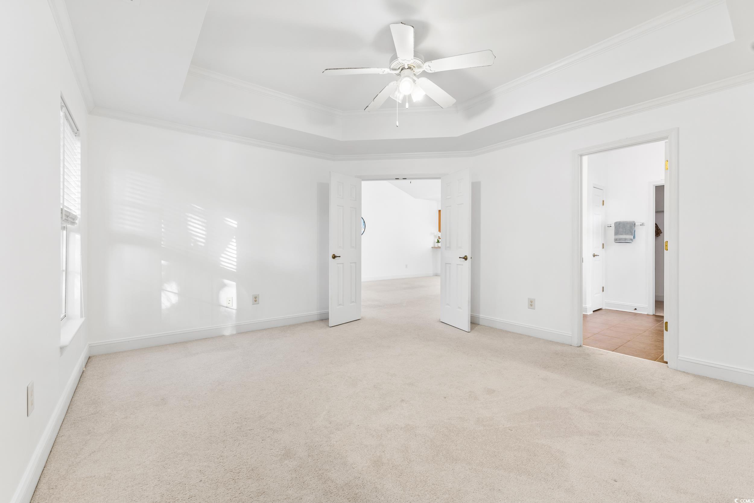 673 Botany Loop, Unit 673 Murrells Inlet, SC 29576 - Photo 28 of 39 Unfurnished bedroom featuring a raised ceiling, or