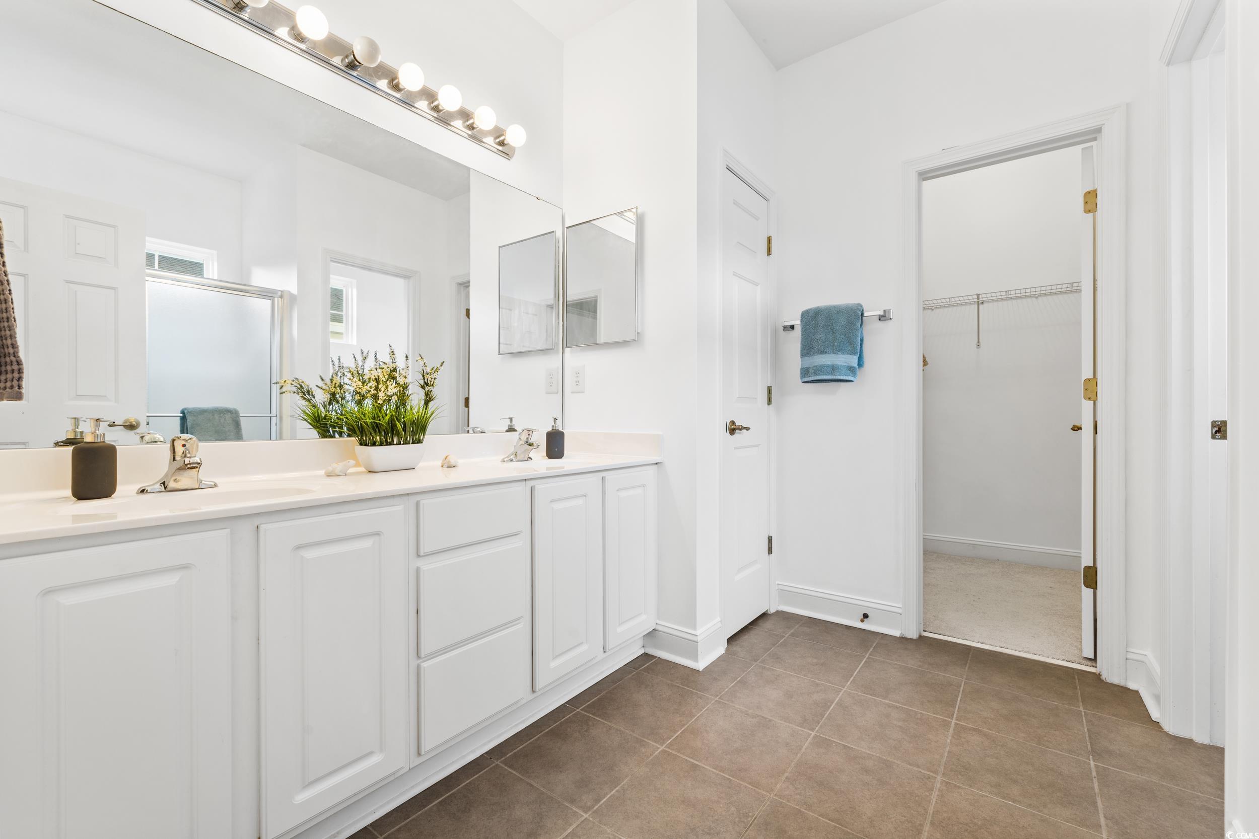 673 Botany Loop, Unit 673 Murrells Inlet, SC 29576 - Photo 29 of 39 Bathroom featuring vanity, a shower with shower do
