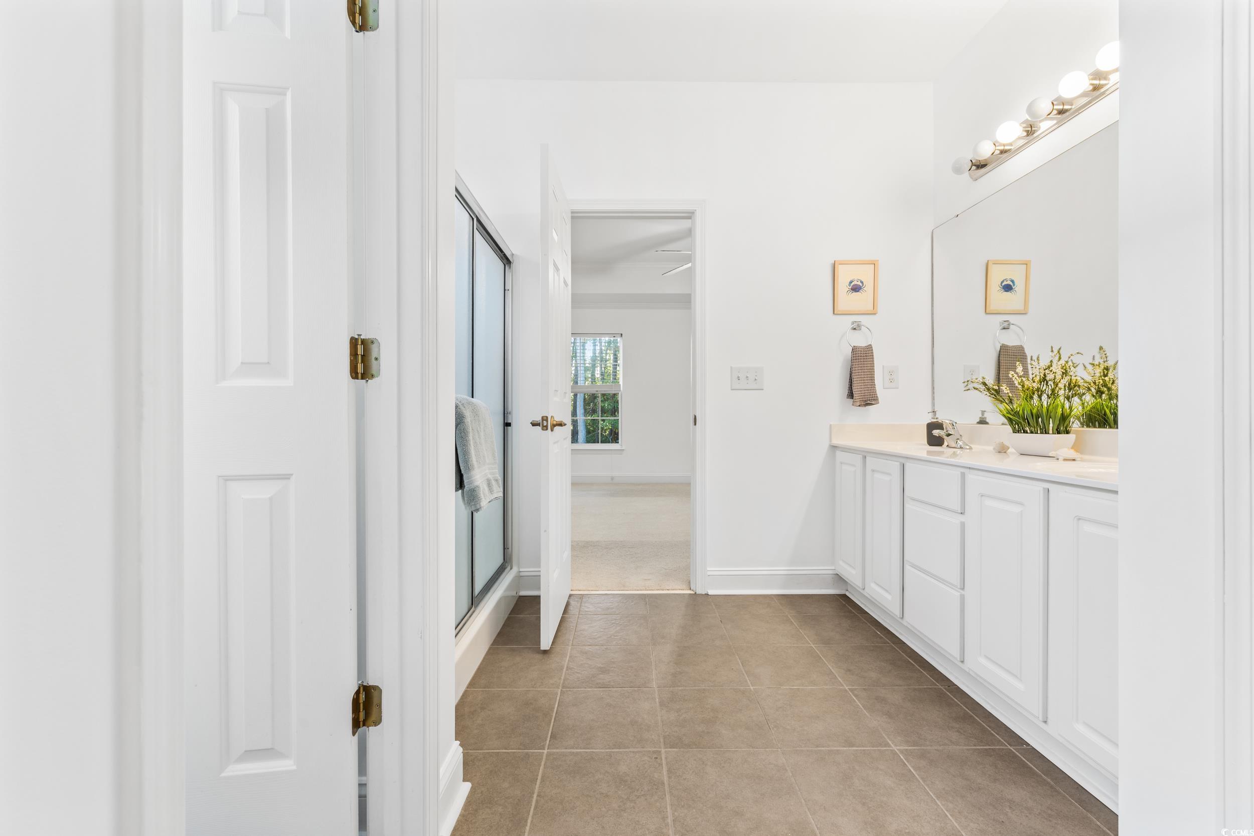 673 Botany Loop, Unit 673 Murrells Inlet, SC 29576 - Photo 30 of 39 Bathroom with vanity, a shower with shower door, a