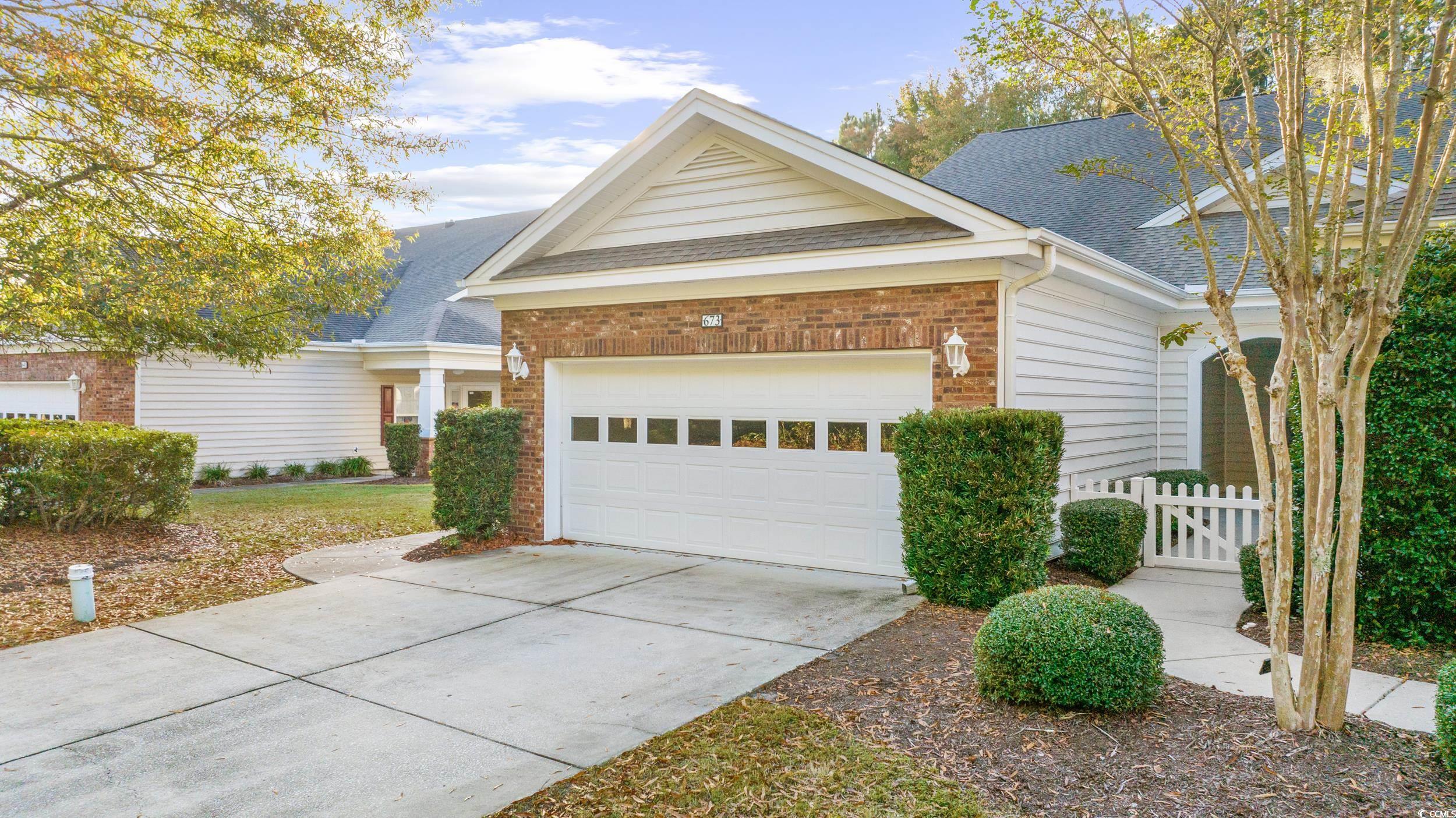 673 Botany Loop, Unit 673 Murrells Inlet, SC 29576 - Photo 3 of 39 View of front of home with a garage