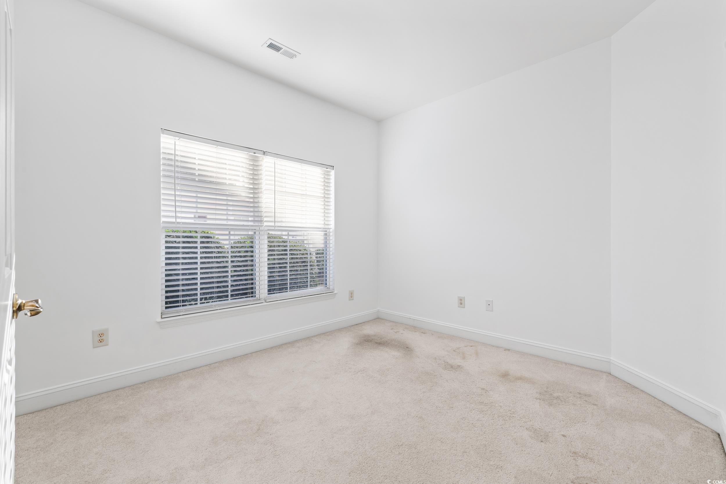 673 Botany Loop, Unit 673 Murrells Inlet, SC 29576 - Photo 10 of 39 Spare room with light carpet