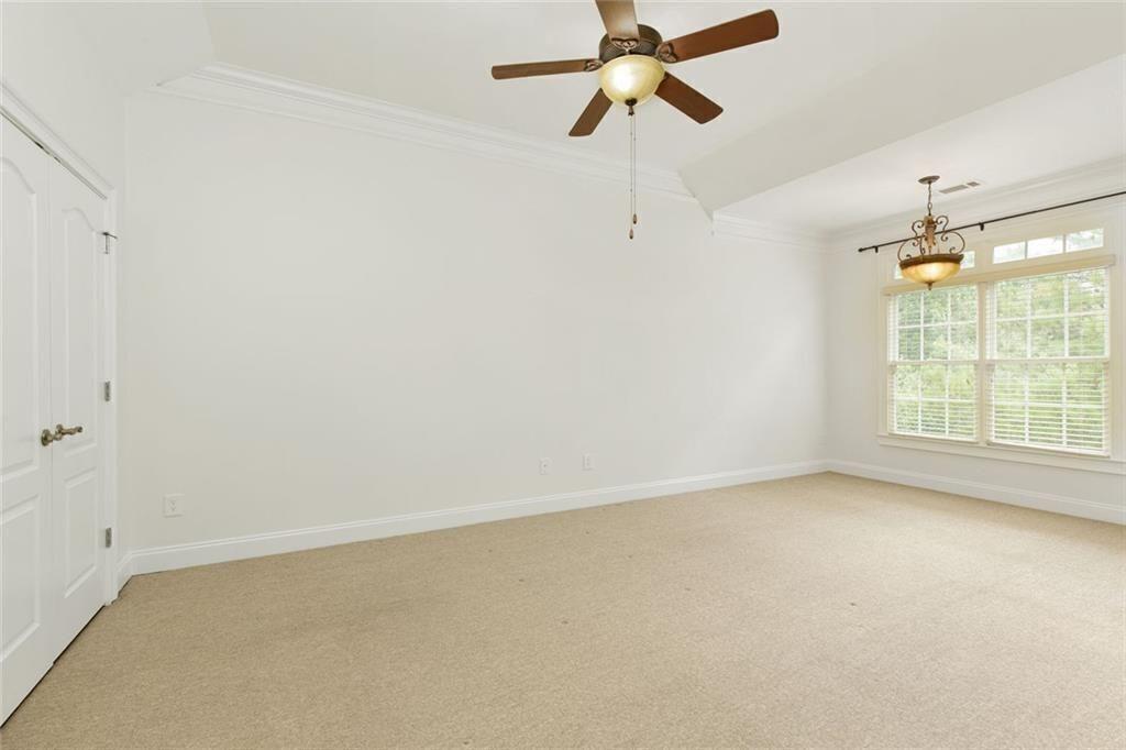 956 Persimmon Point Northeast Sandy Springs, GA 30328 - Photo 23 of 35 an empty room with a window and a fan