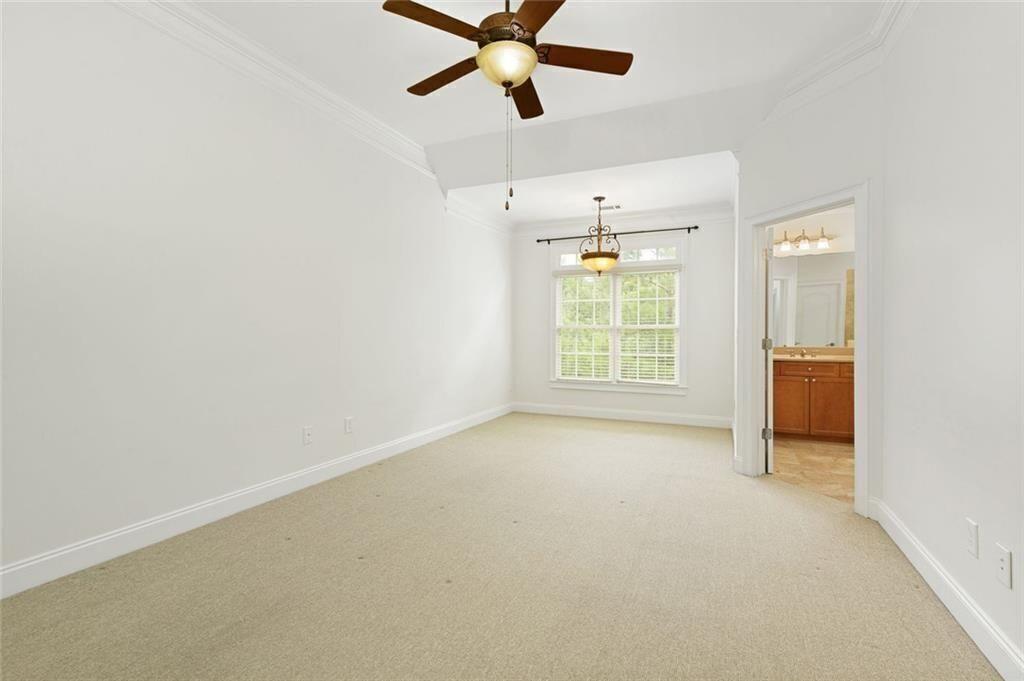 956 Persimmon Point Northeast Sandy Springs, GA 30328 - Photo 24 of 35 an empty room with windows and fan
