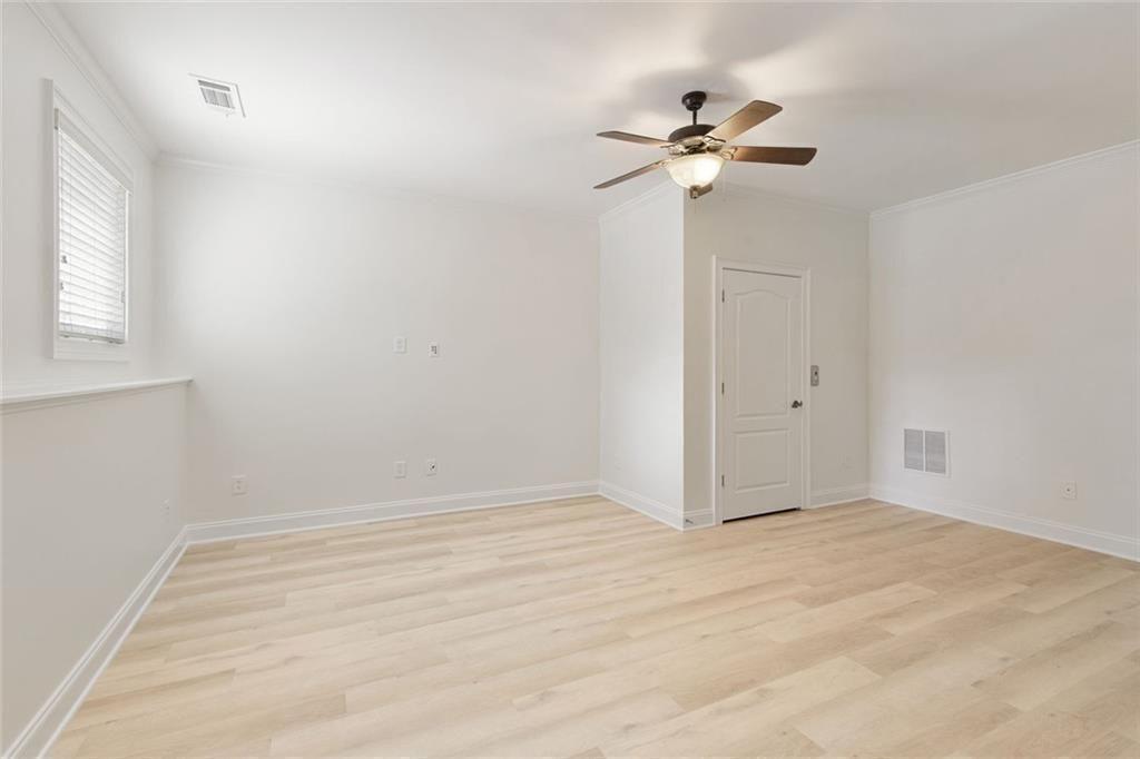 956 Persimmon Point Northeast Sandy Springs, GA 30328 - Photo 31 of 35 a view of a room with a ceiling fan and a window