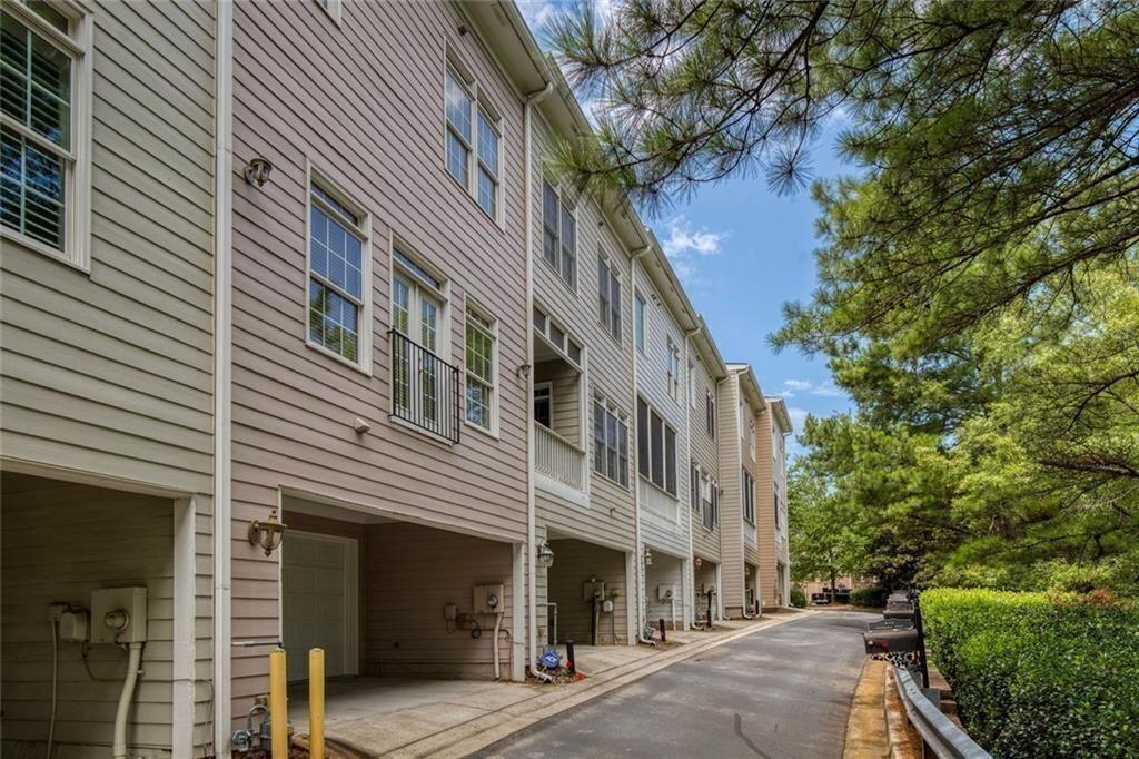 956 Persimmon Point Northeast Sandy Springs, GA 30328 - Photo 33 of 35 a view of a building with a tree