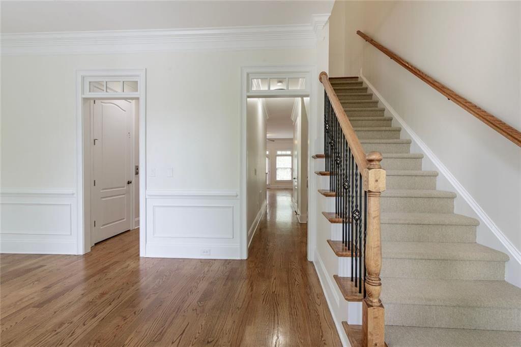 956 Persimmon Point Northeast Sandy Springs, GA 30328 - Photo 7 of 35 a view of a hallway with wooden floor and entryway