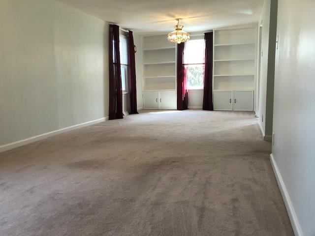 102 Freedom Road Butler, PA 16001 - Photo 7 of 20 Living room/ dining room combo with 2 matching built ins.