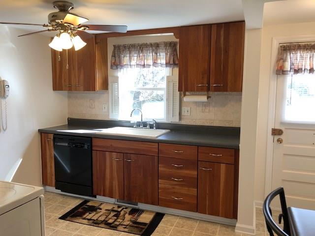 102 Freedom Road Butler, PA 16001 - Photo 9 of 20 Inviting kitchen with cherry cabinets, pristine acrylic sink, and natural light.