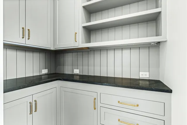 a kitchen with white cabinets