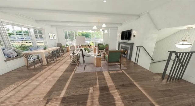 a living room with patio furniture and a flat screen tv