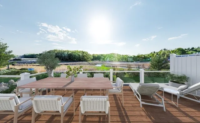 a view of a terrace with furniture and a table