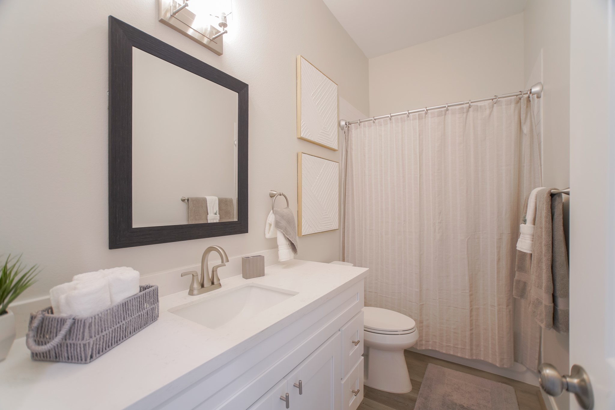 504 Nursery Road, Unit 3206 The Woodlands, TX 77380 - Photo 25 of 35 a bathroom with a granite countertop sink a toilet and a mirror