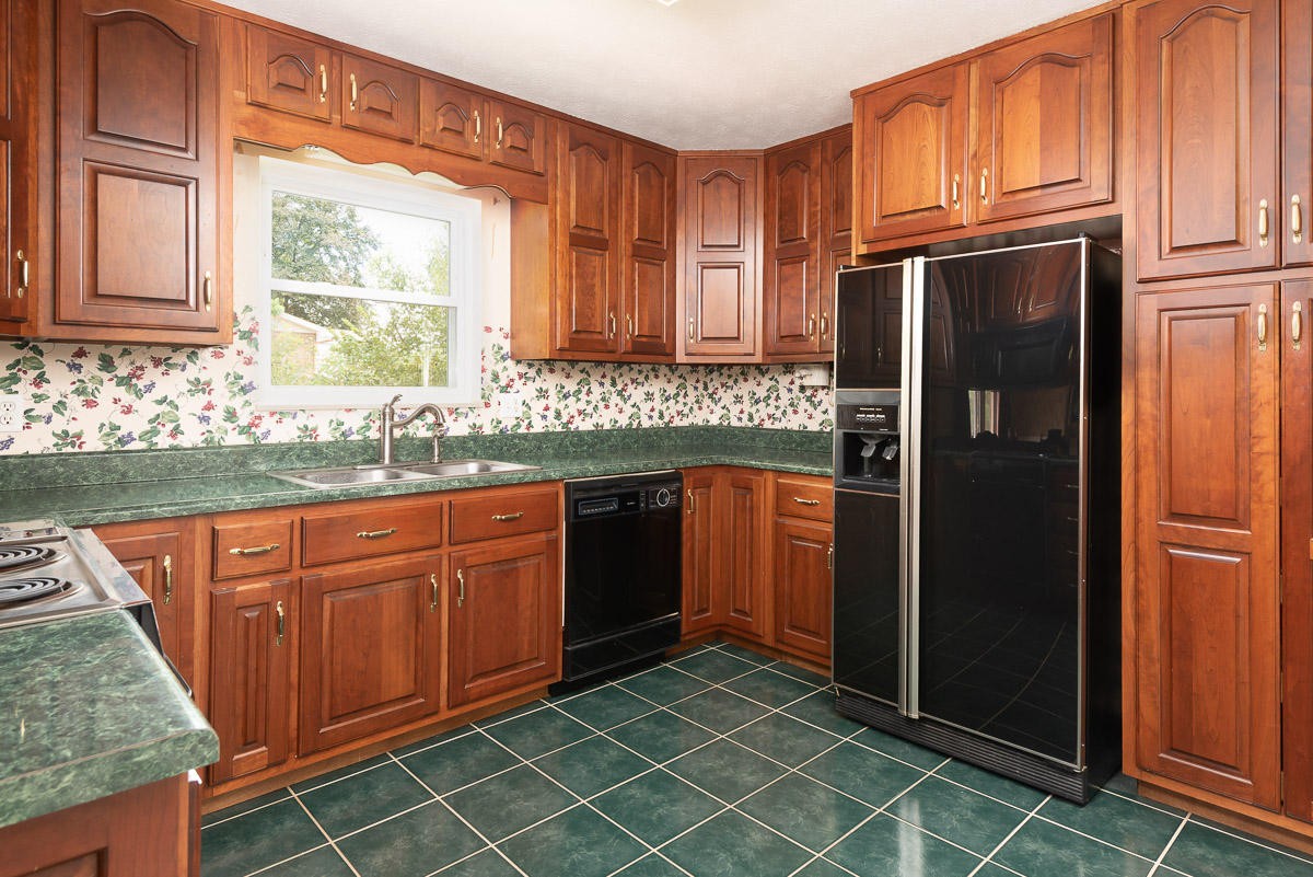 120 Cedar Road Clinton, TN 37716 - Photo 11 of 15 a kitchen with stainless steel appliances granite countertop a refrigerator and a sink