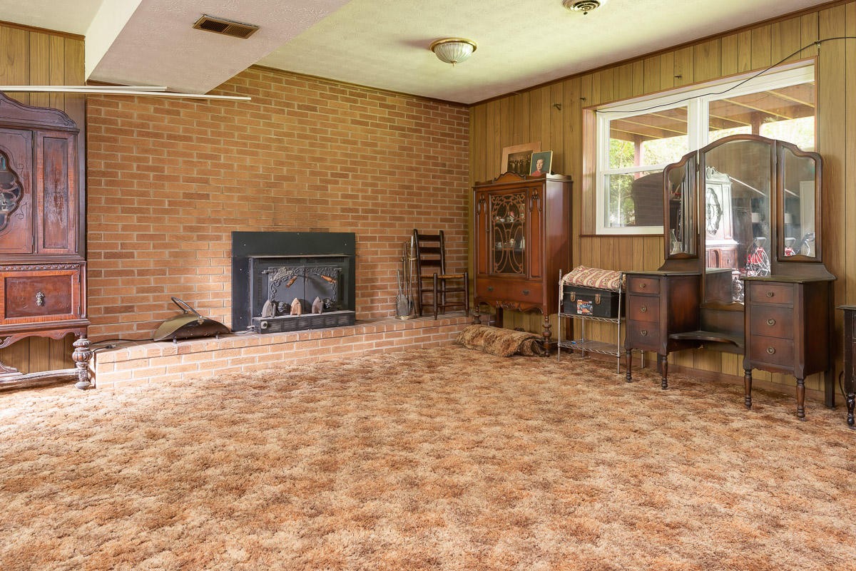 120 Cedar Road Clinton, TN 37716 - Photo 13 of 15 a living room with furniture and a fireplace