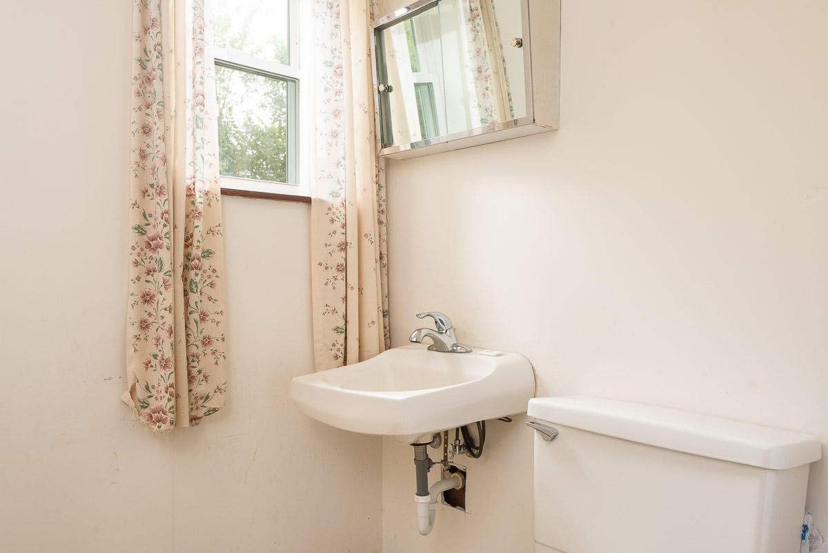 120 Cedar Road Clinton, TN 37716 - Photo 14 of 15 a bathroom with a sink and a mirror
