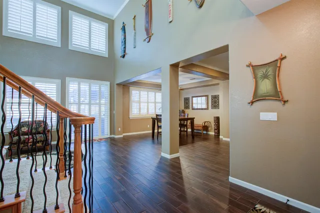 a living room with furniture a fireplace and a table