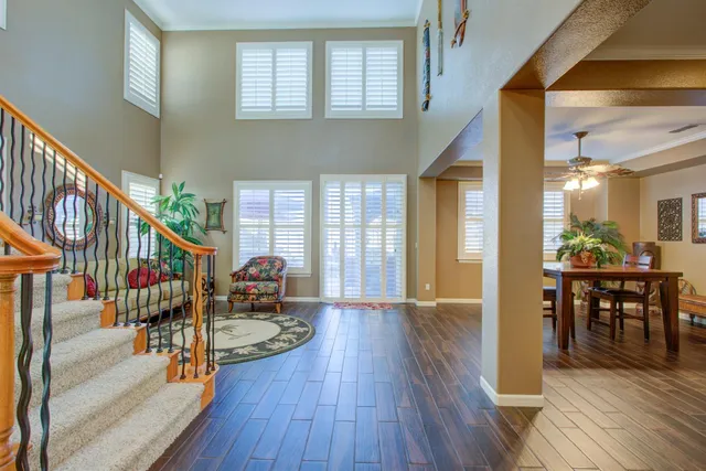 a view of a dining room with furniture and wooden floor