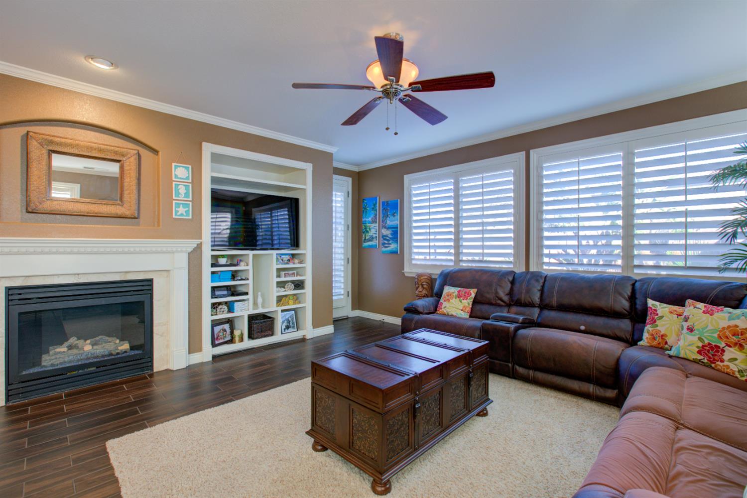 621 Bouma Lane Ripon, CA 95366 - Photo 39 of 78 a living room with furniture a fireplace and a large window