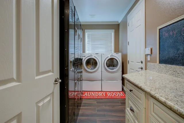 a view of a patio with table and chairs potted plants