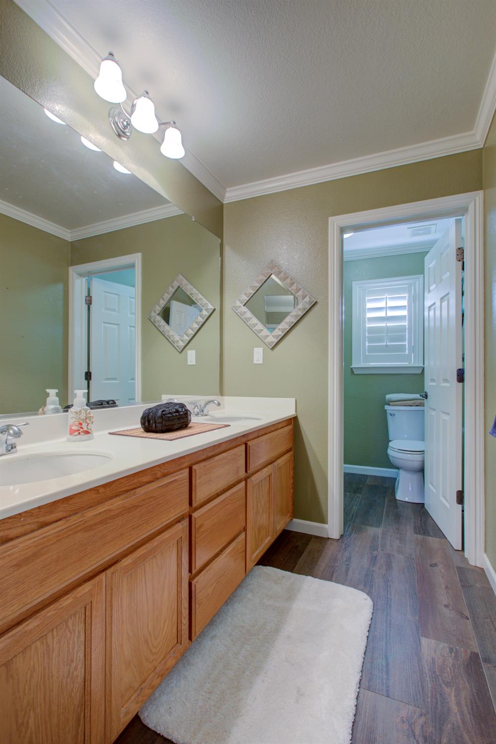 621 Bouma Lane Ripon, CA 95366 - Photo 48 of 78 a spacious bathroom with a double vanity sink and a mirror