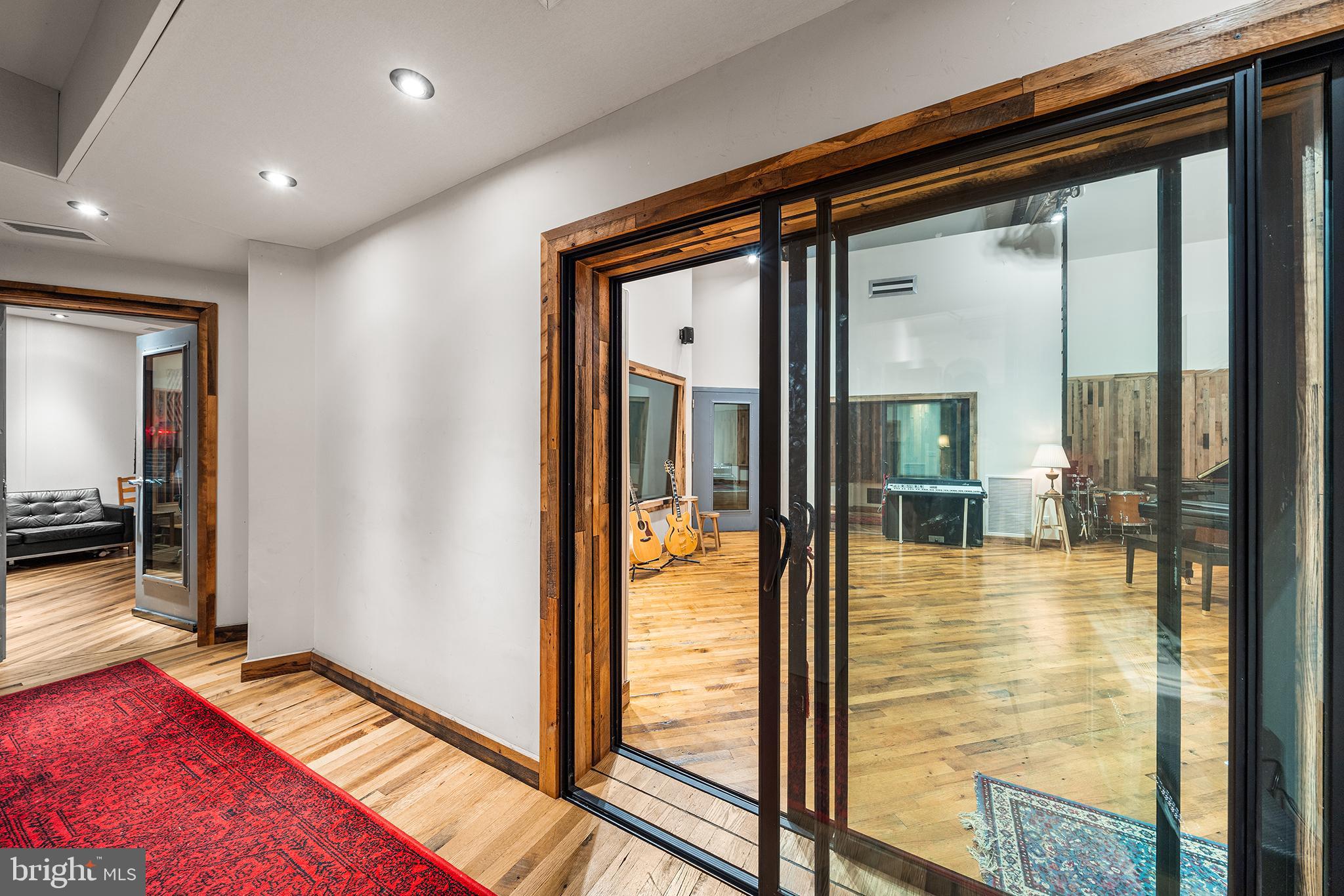 1506 East Wilt Street Philadelphia, PA 19125 - Photo 13 of 50 a view of a hallway with wooden floor and glass door