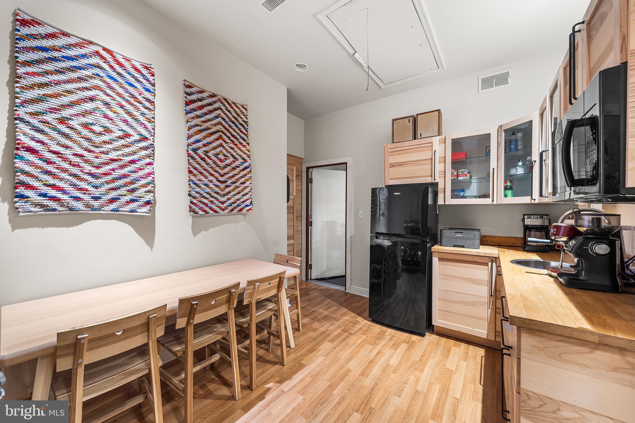 1506 East Wilt Street Philadelphia, PA 19125 - Photo 17 of 50 a kitchen with stainless steel appliances granite countertop a refrigerator and microwave