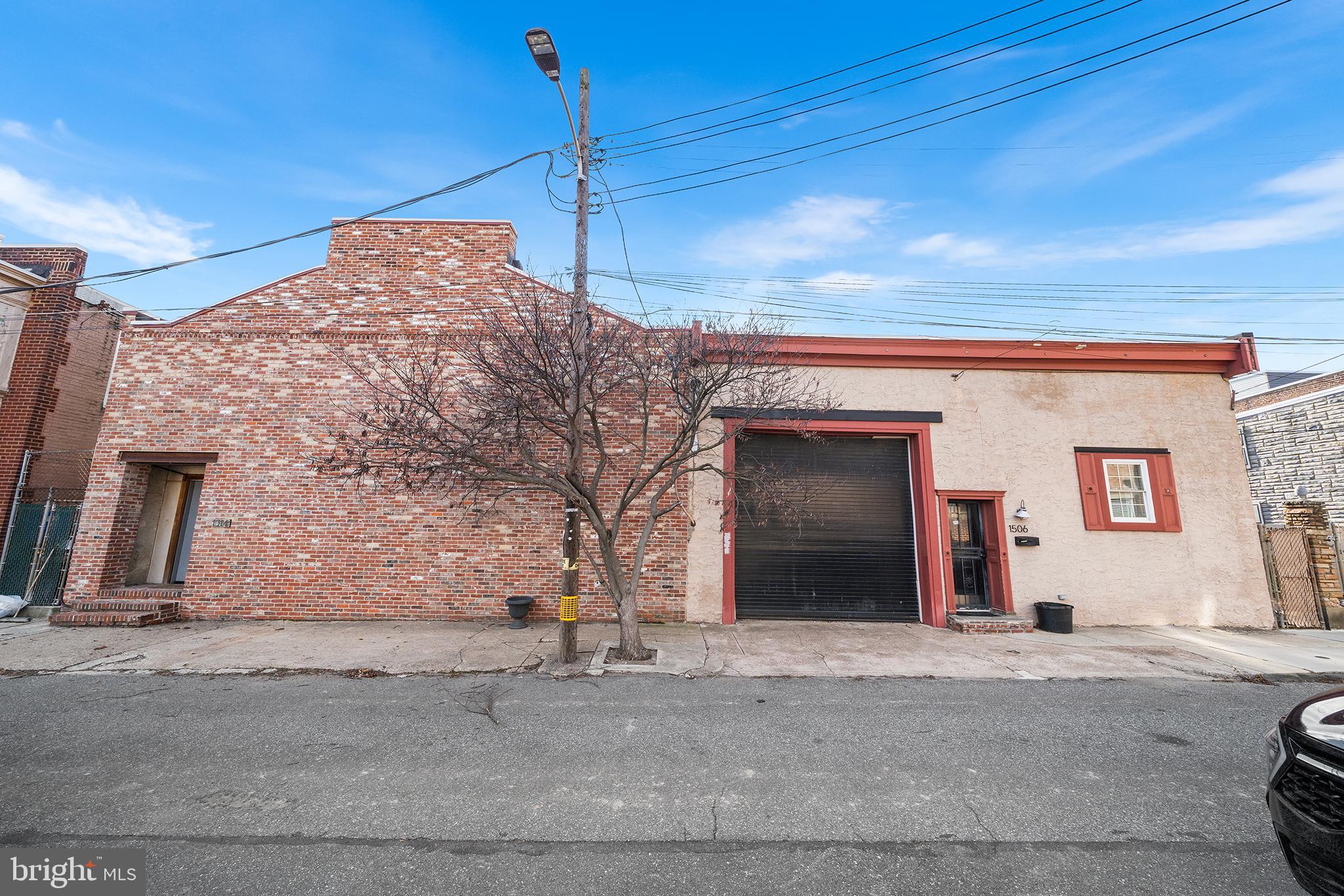 1506 East Wilt Street Philadelphia, PA 19125 - Photo 2 of 50 a front view of a house with a garden
